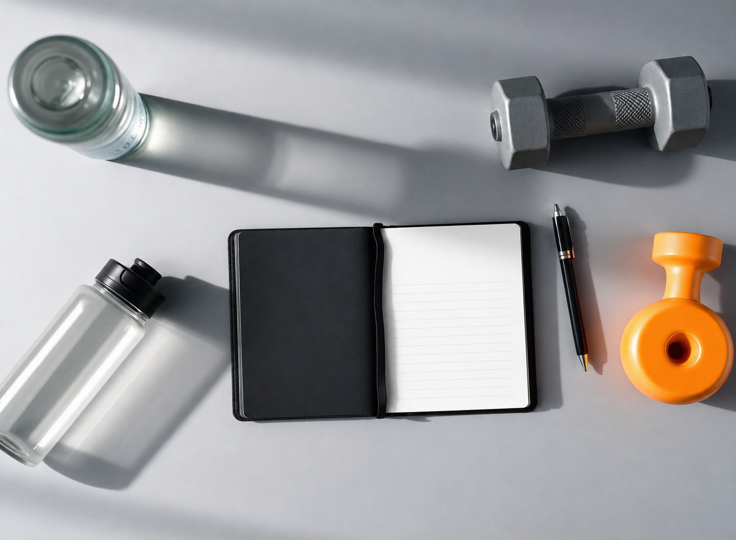 Open training journal and gear on a clean desk